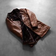 Styled Fit Perspective of Men's Cinnamon Effetto Usurato Leather Fur Cappotto in Pelle da Uomo on Model - Natural Daylight Drape