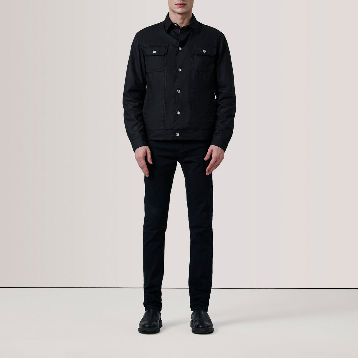 
Black Waxed Cotton Canvas Leather Jacket - Vista posteriore con spalle definite e orlo pulito