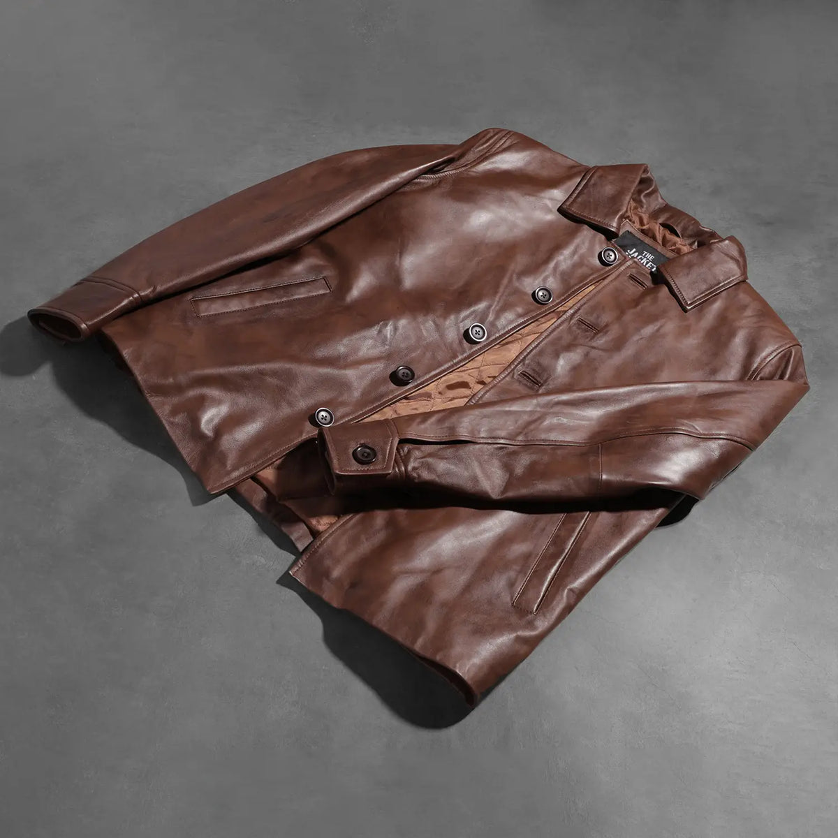 Buttoned &amp; Hem Craftsmanship Construction Detail on Waffle Marrone Giacca in Pelle da Uomo